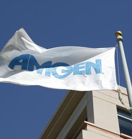 Amgen flag flying against blue sky