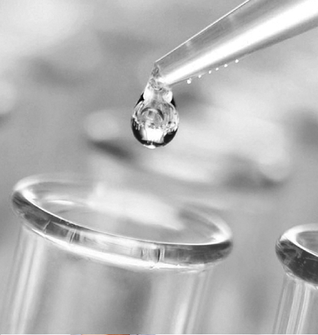 Close up of dripper dripping into test tubes